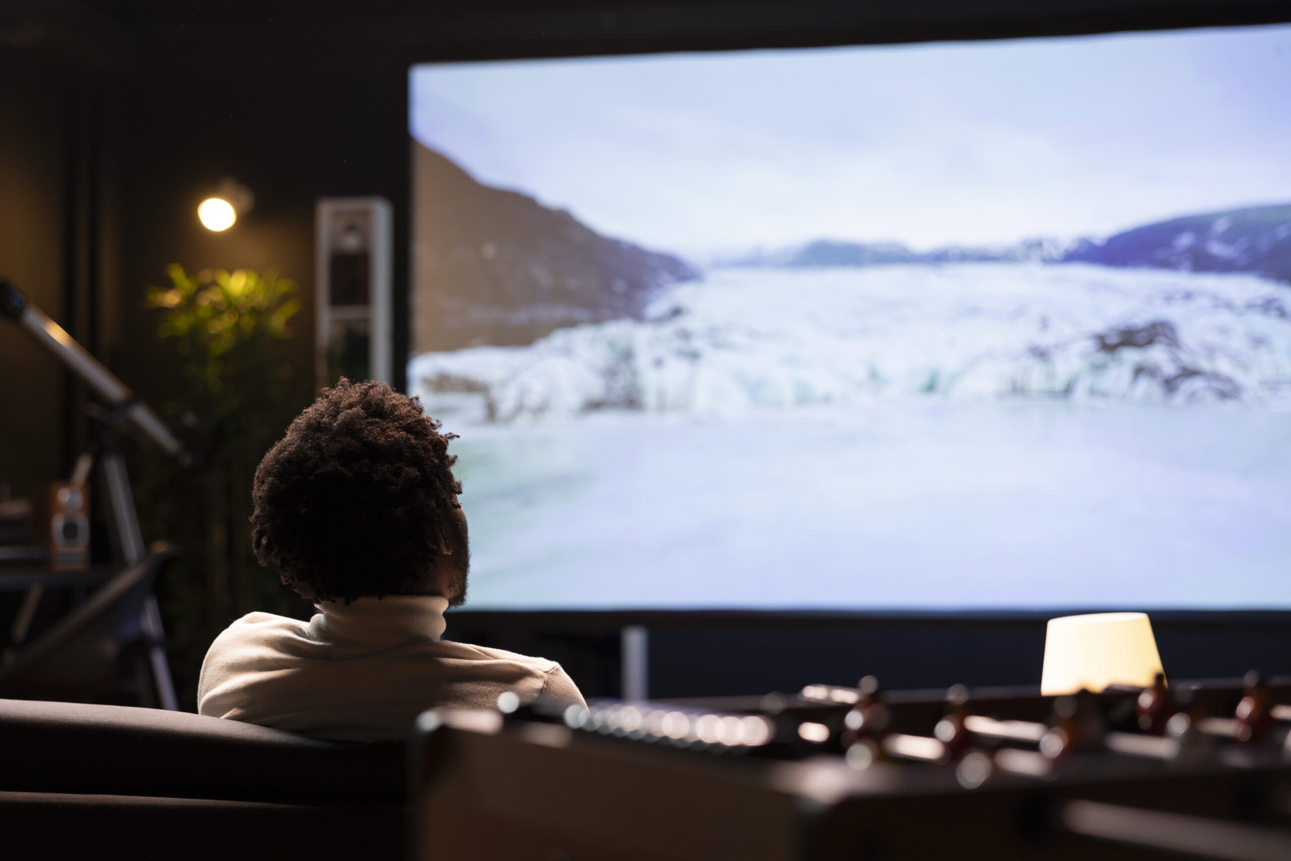 Man enjoying scenery shots of snowy landscape filled with ice on VOD channel